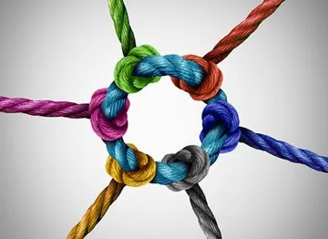 6 verschillende kleuren geknoopt aan elkaar, samen vormen ze een rondje. Wat linkbuilding uitbeeld